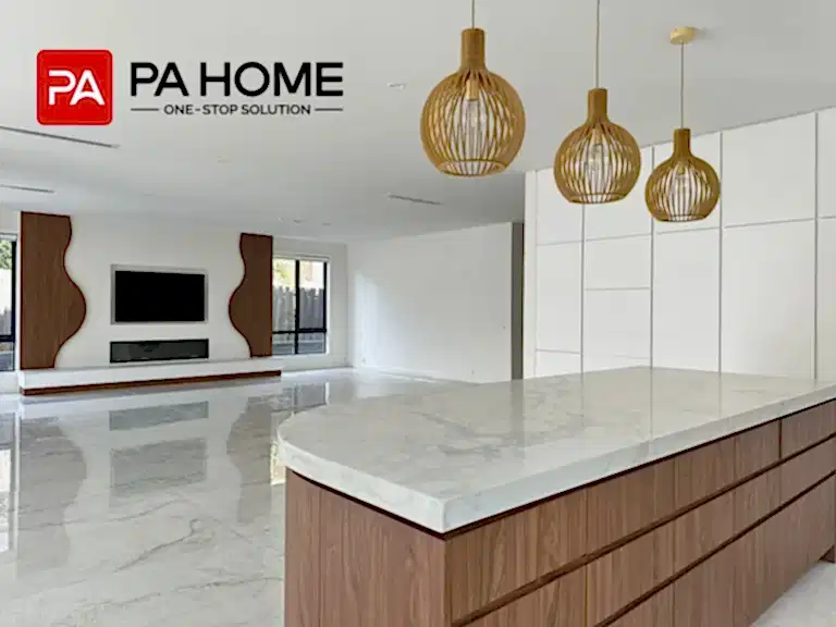 A white and walnut Melbourne kitchen using Y111 wood-grain cabinetry, L3110B lacquer panels, and marble-look surfaces for a quiet luxury interior.